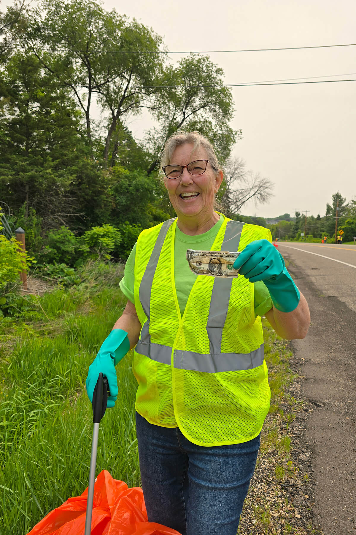 Bailey Nurseries Adopt-A-Highway volunteer finds a dollar.