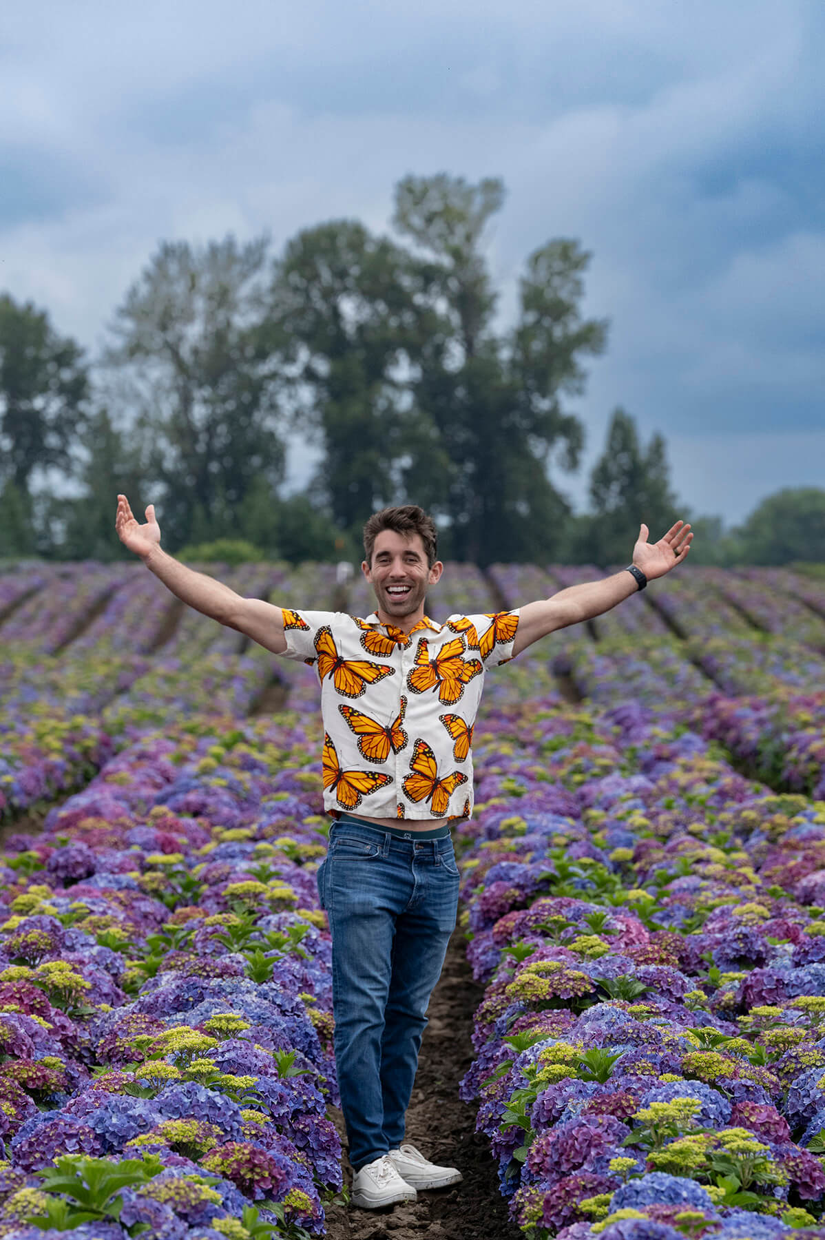 Creator standing in hydrangea field