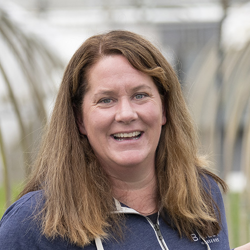 Stacia Lynde, Department Head of Propagation–Dayton at Bailey Nurseries, pictured in a greenhouse.